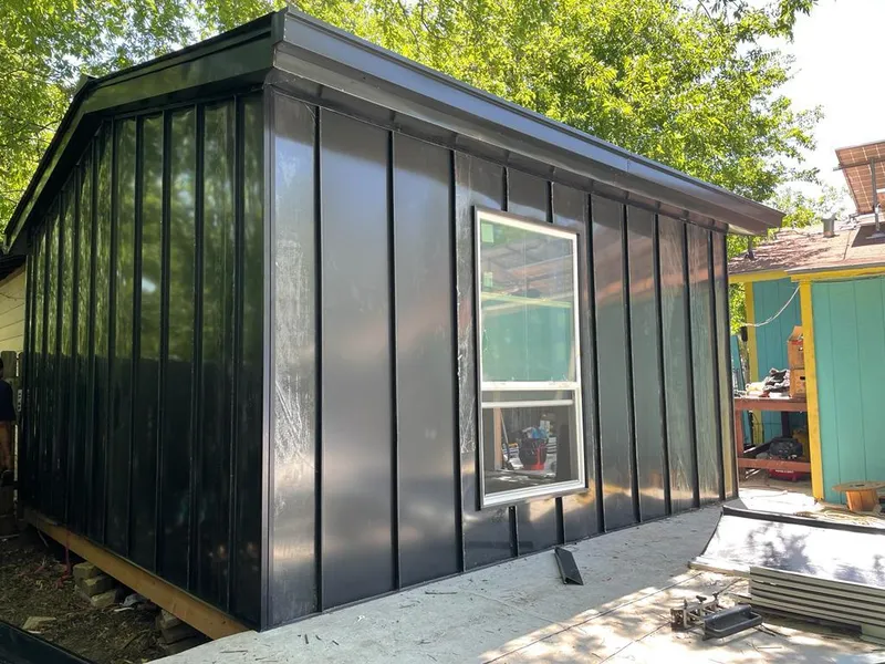 Black standing seam metal wall panels for Roof Inspection in Corpus Christi