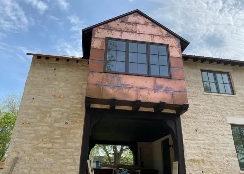 Copper metal panel facade on a stone building for Skylight Installation in Corpus Christi