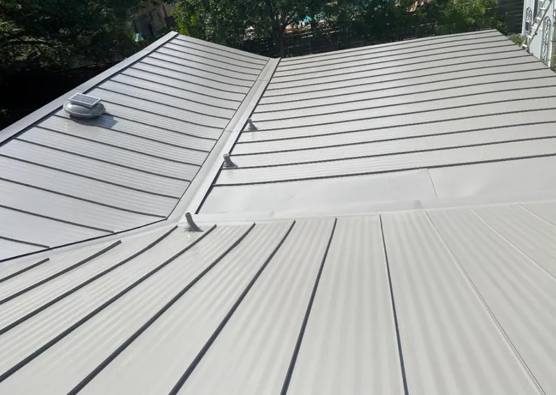Solar attic fan installed on a metal roof for Roof Ventilation in Corpus Christi